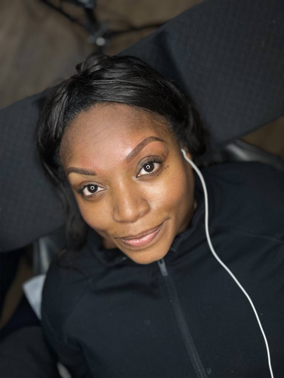 Client selfie after a session at MK Permanent Makeup