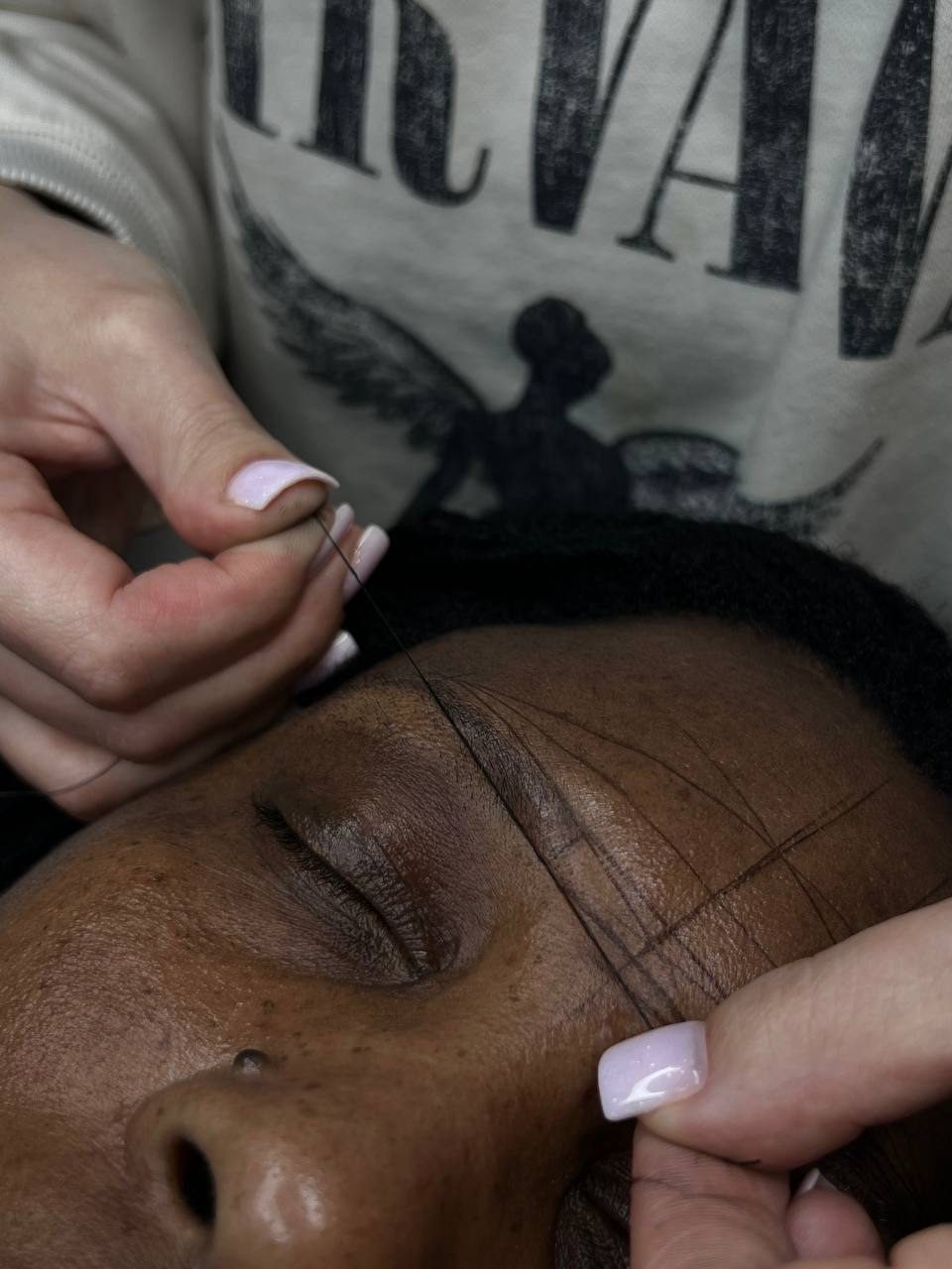 Brow shaping procedure in progress