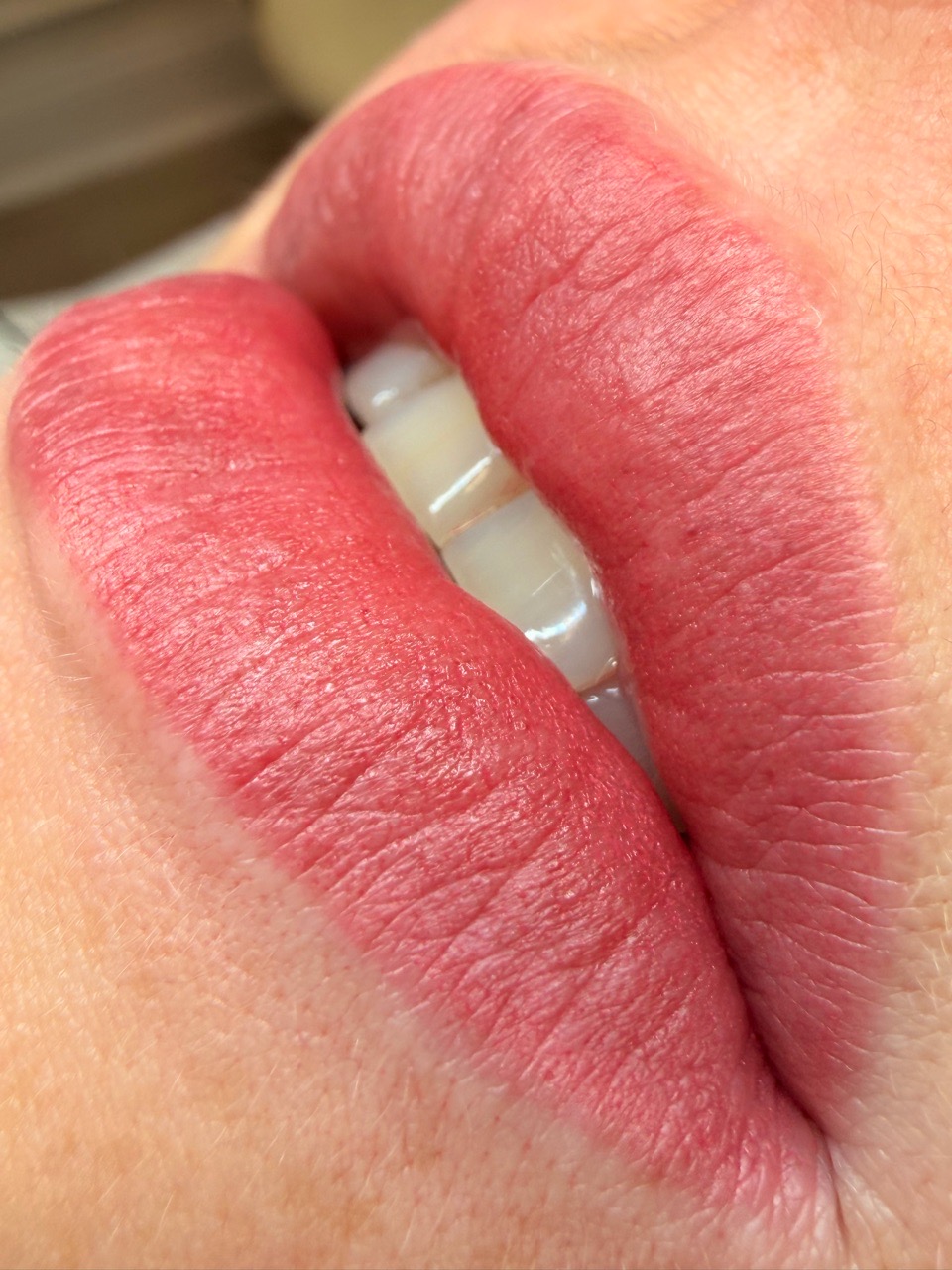 Lip blush — fresh pink result, close-up