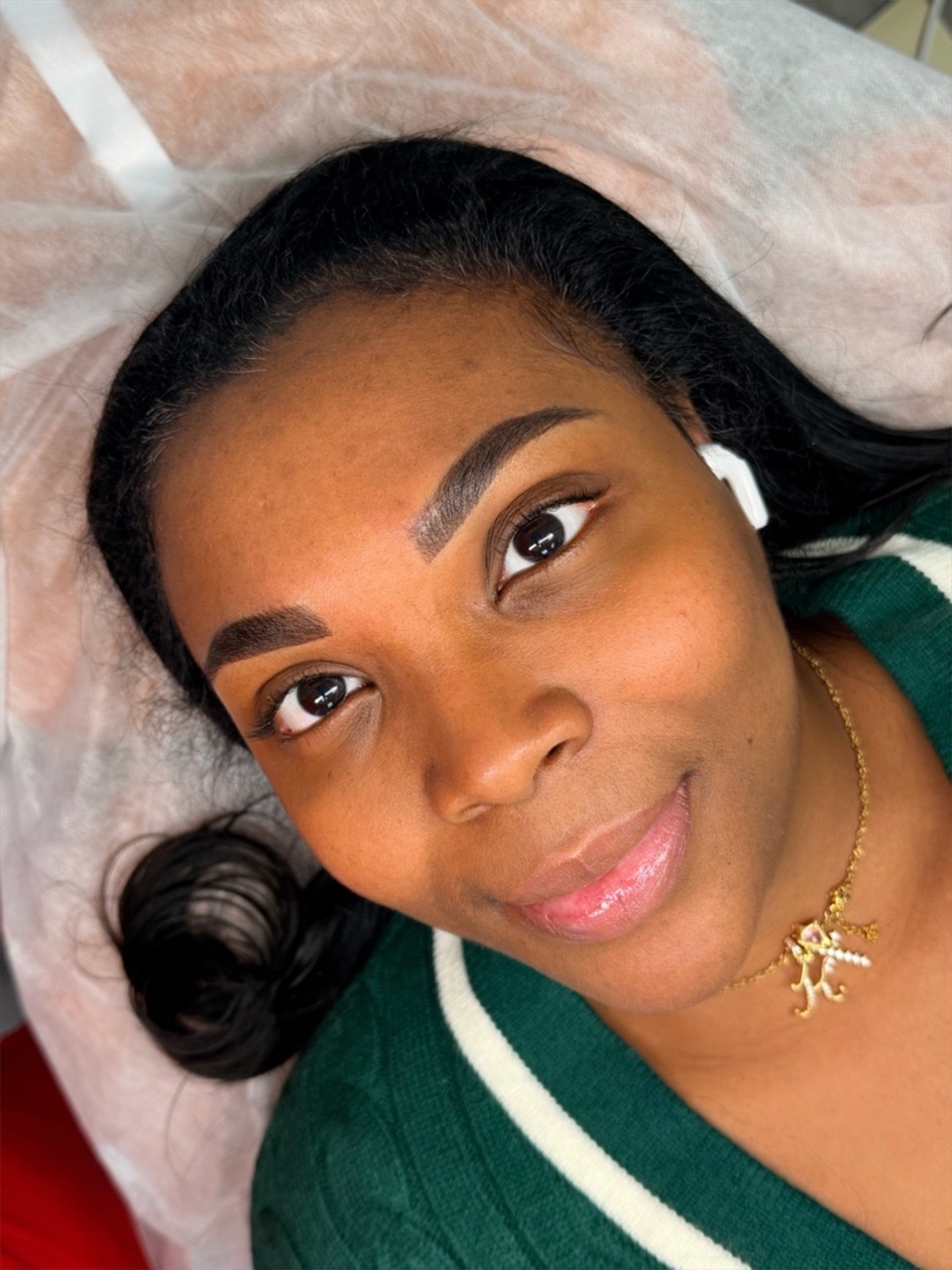 Client selfie after brow procedure at MK Permanent Makeup